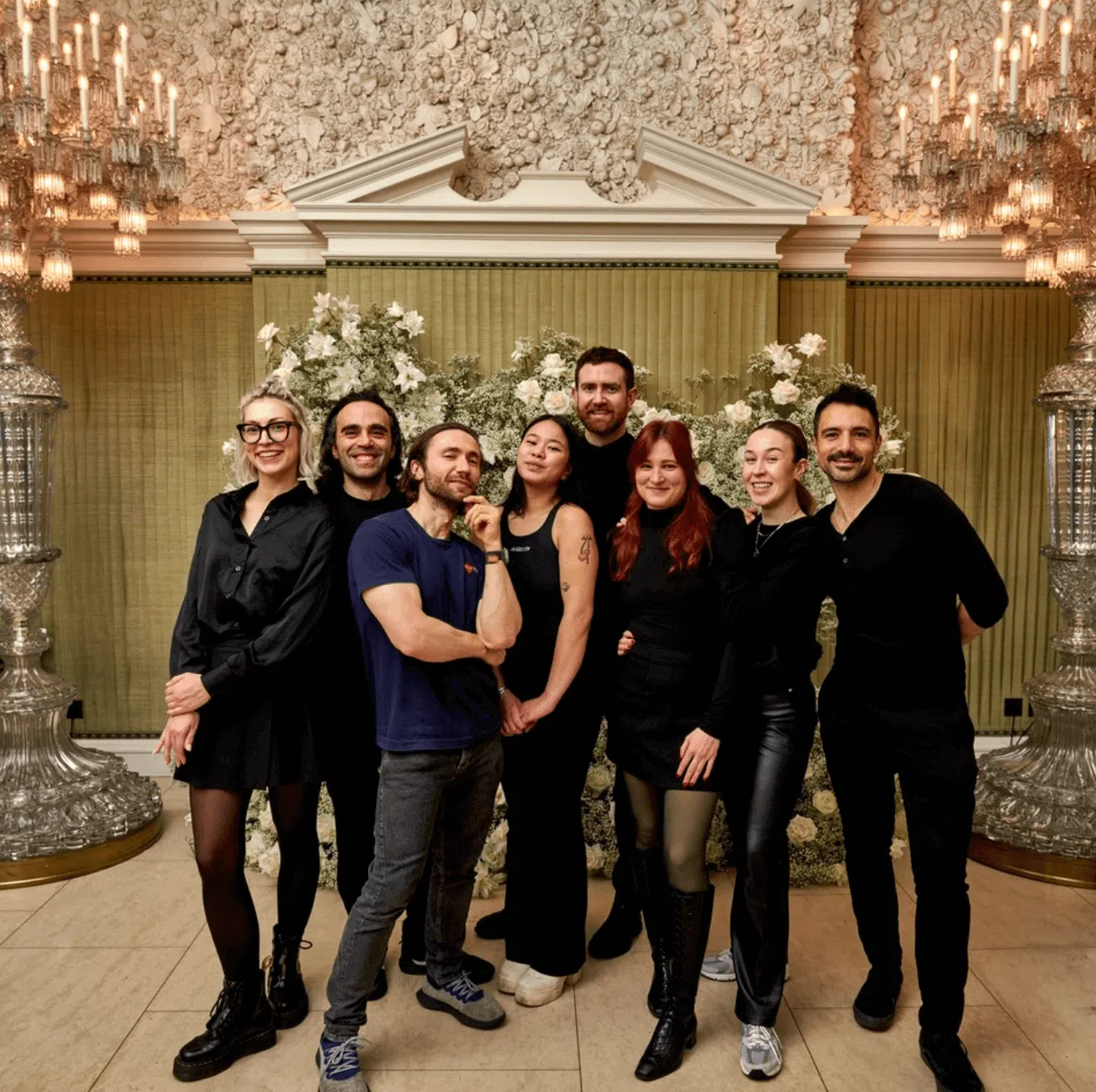 Blooming haus – europe's first b corp-certified event florist 4 The team at blooming haus standing in front of vogue's annual fashion and film party floral designs at annabel's.