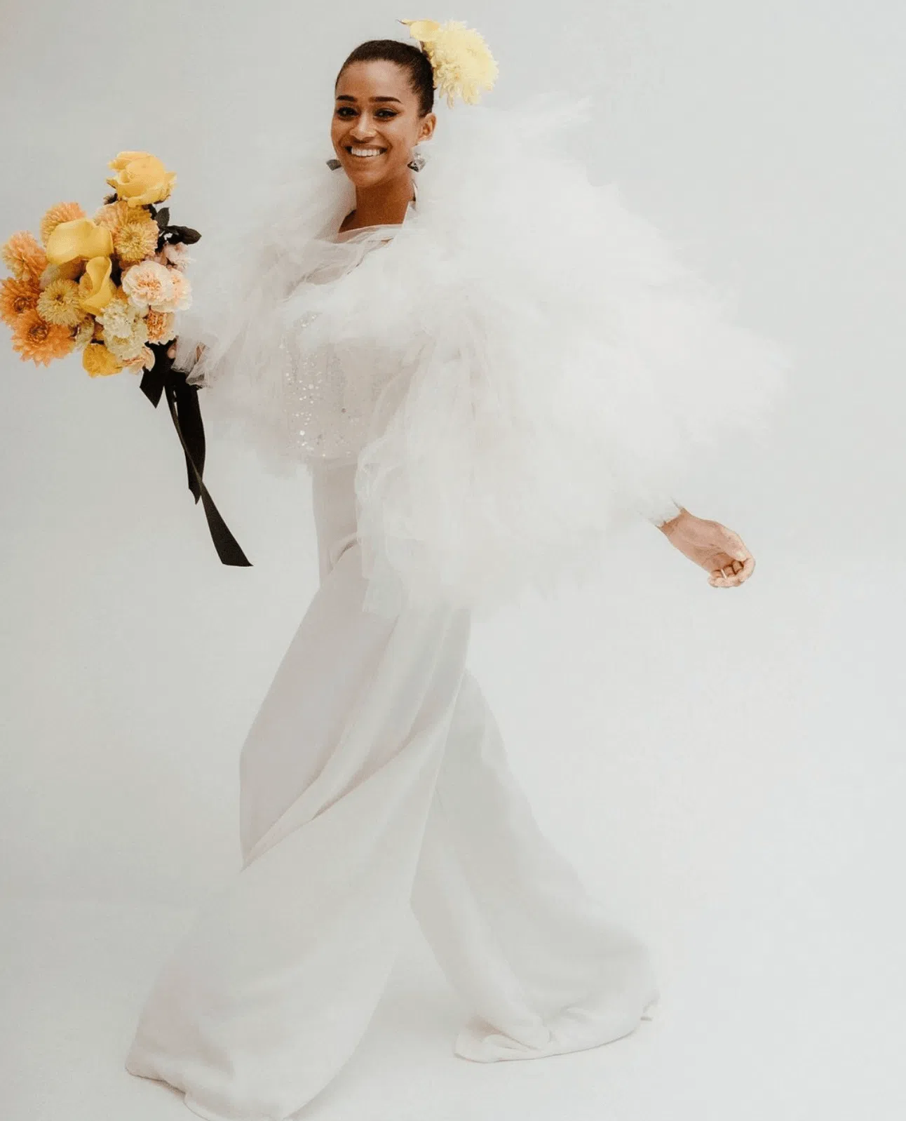 Womens wedding suit with bouquet