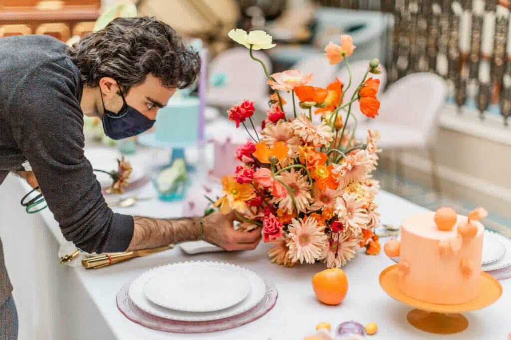 Colourful flower arrangements with orange poppies and peach daisies