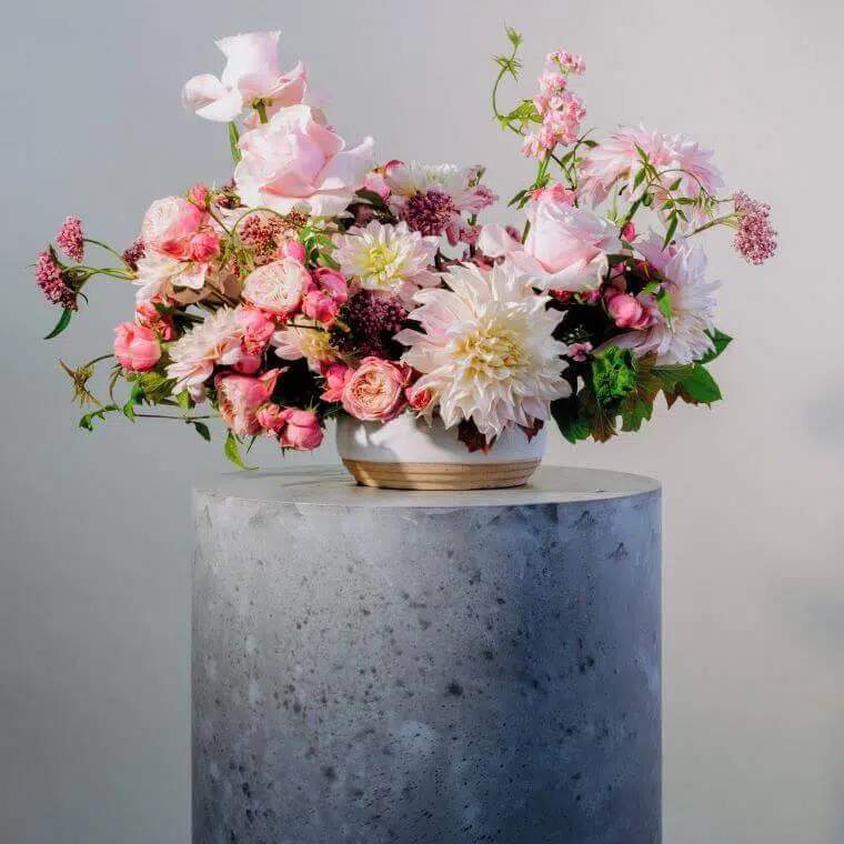 A floral display in shades of pink by blooming haus