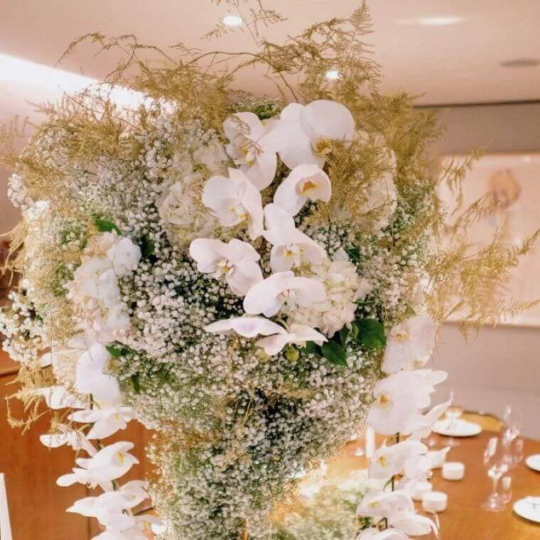 A large cascading floral display with billowing white orchids