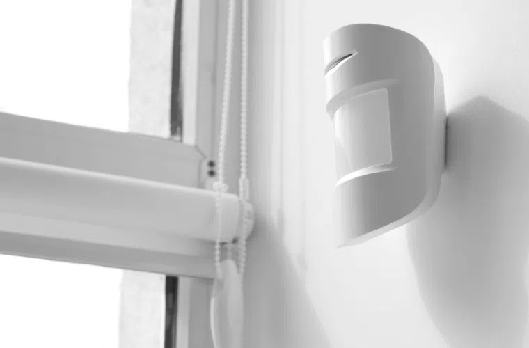 How can my business help fight climate change in 2025? 13 An occupancy sensor attached to a wall