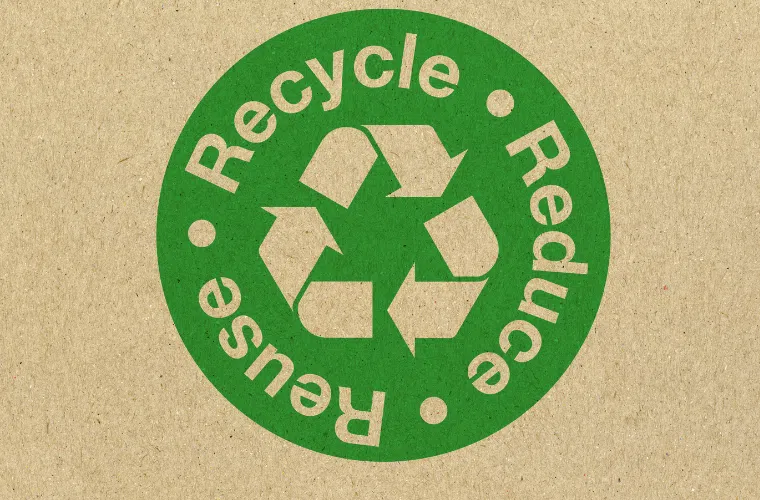 How can my business help fight climate change in 2025? 5 A green recycle, reduce, reuse sign