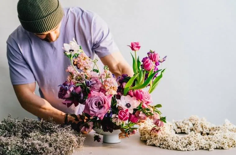 Purple flower arrangement by blooming haus