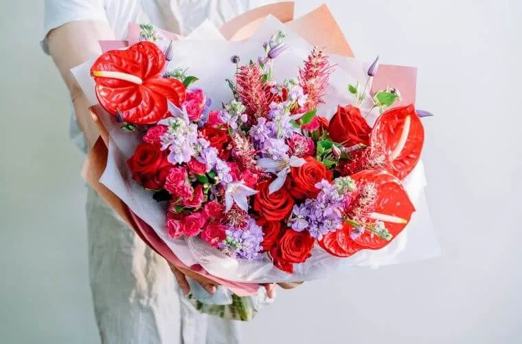 Red and lilac bouquet by blooming haus
