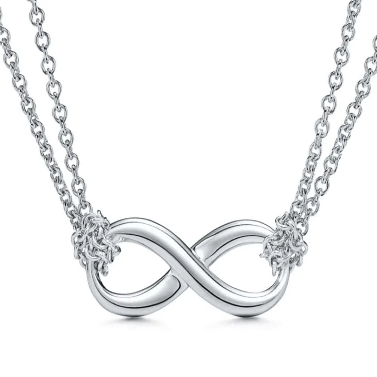 A silver infinity pendant by tiffany & co