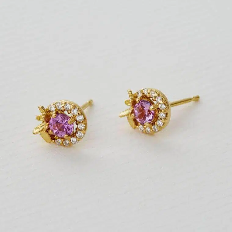 A pair of pink madagascan sapphire and diamond stud earrings
