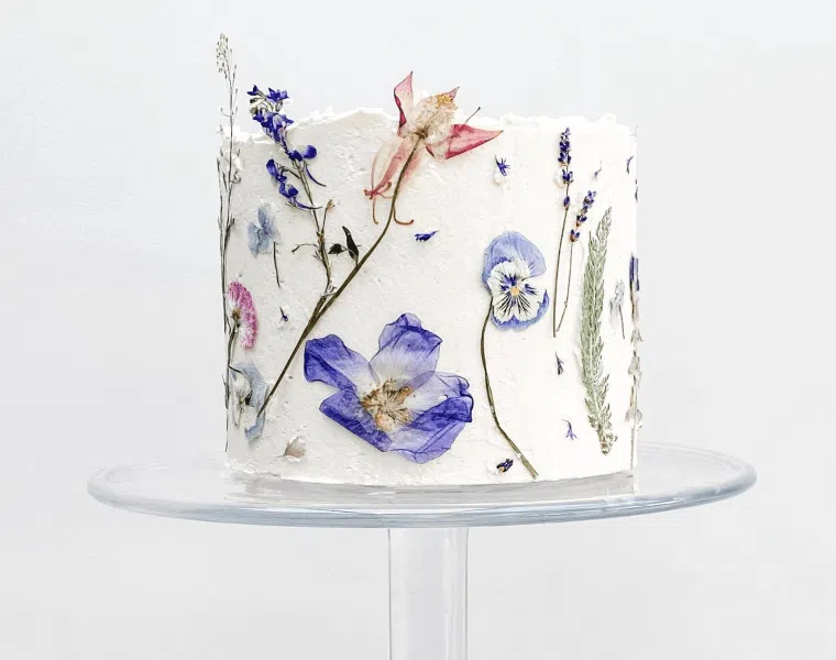 Pressed edible flowers on a wedding cake