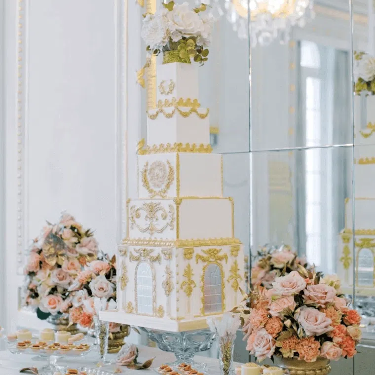 Rose and gold wedding cake and flowers