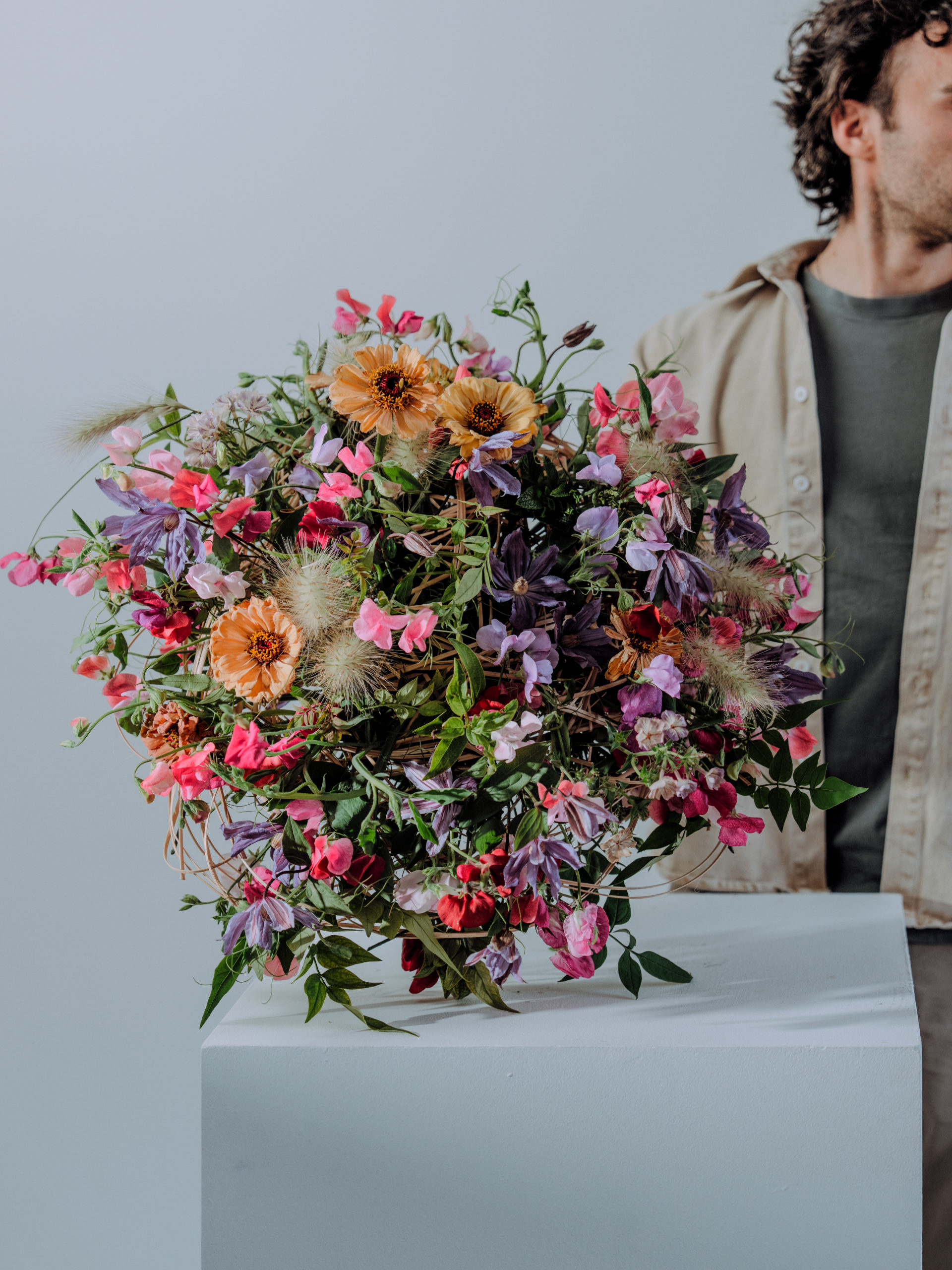 Red roses arranged on white and red cloth