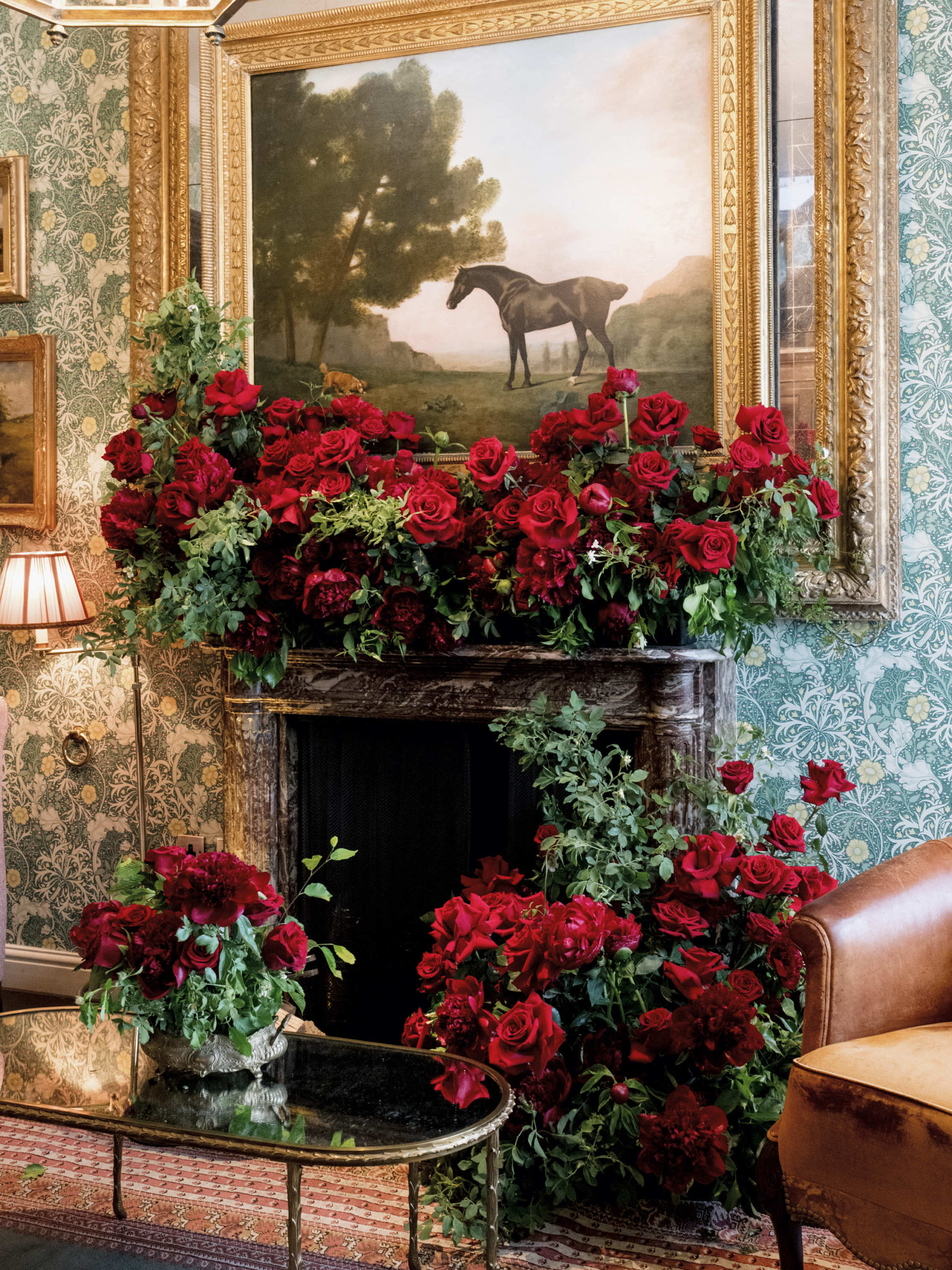 How much do wedding flowers cost in london? A considered guide 3 Luxurious floral arrangement in a fireplace.